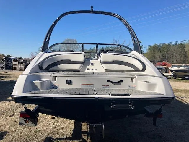 Slide: The Image of 2024 Yamaha Boats 195S, rear view, showcasing sleek design and spacious seating. - 4