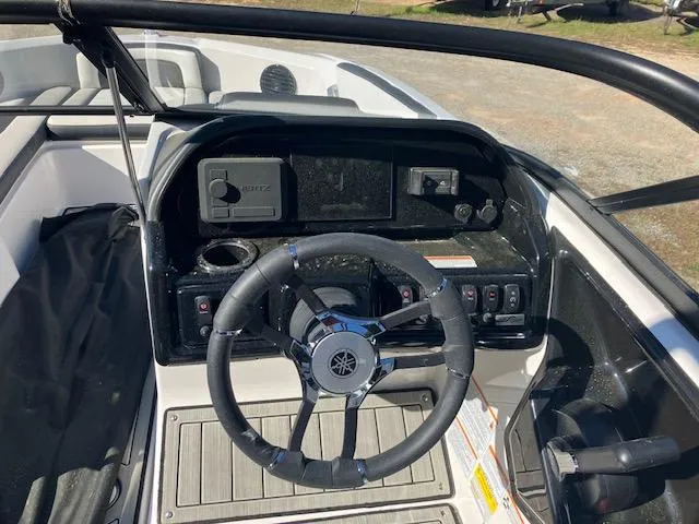 Slide: The Image of 2024 Yamaha Boats 195S dashboard with steering wheel and control panel. - 5