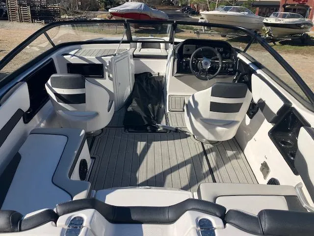Slide: The Image of 2024 Yamaha Boats 195S interior, featuring sleek seating and modern dashboard design. - 6