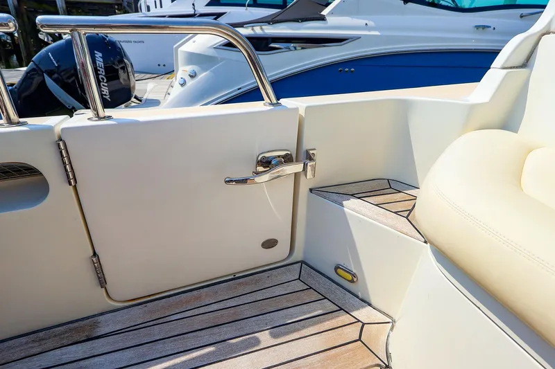 Slide: The Image of MJM 40z Downeast 2010 boat interior with teak flooring and stainless steel details. - 16