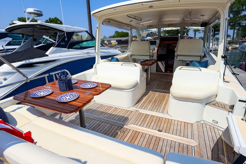 Slide: The Image of 2010 MJM 40z Downeast yacht interior with elegant seating and dining setup. - 20