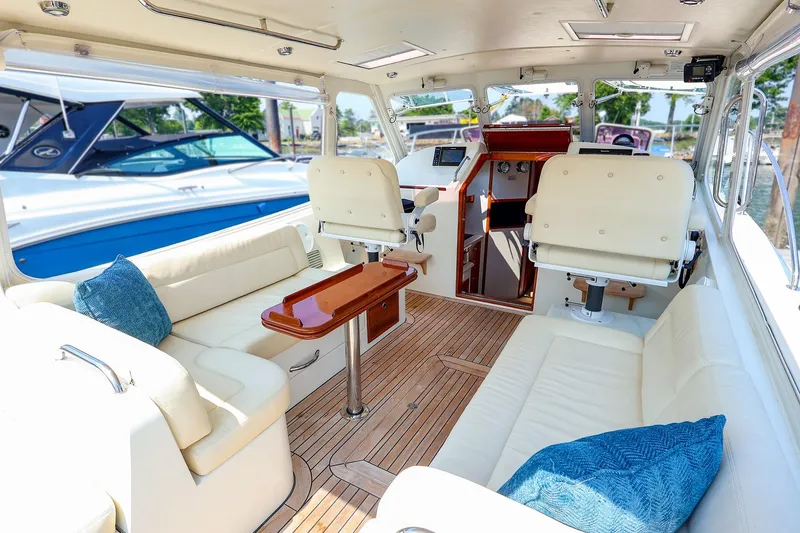 Slide: The Image of Interior of 2010 MJM 40z Downeast yacht with luxurious seating and wooden flooring. - 21