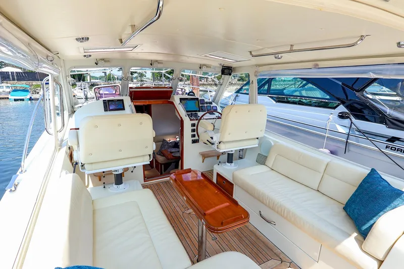 Slide: The Image of Luxurious interior of 2010 MJM 40z Downeast yacht with plush seating and modern navigation equipment. - 22