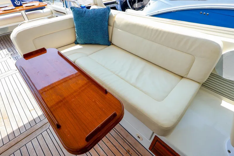 Slide: The Image of Luxurious seating area on 2010 MJM 40z Downeast yacht with wooden table and cushion. - 23