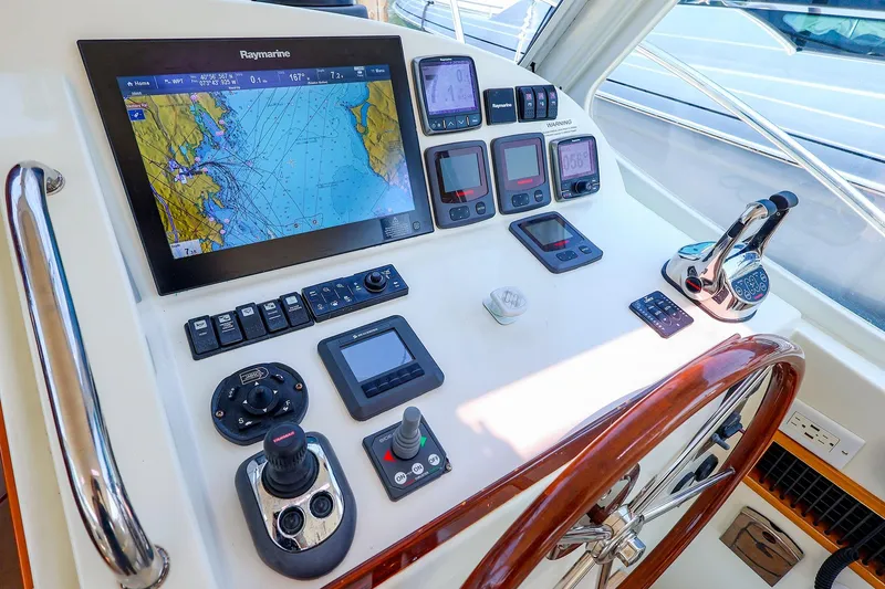 Slide: The Image of Helm of 2010 MJM 40z Downeast boat with navigation equipment and wooden steering wheel. - 28
