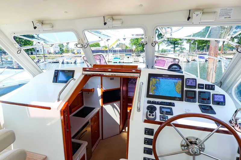 Slide: The Image of Interior view of 2010 MJM 40z Downeast boat with navigation equipment and steering wheel. - 31