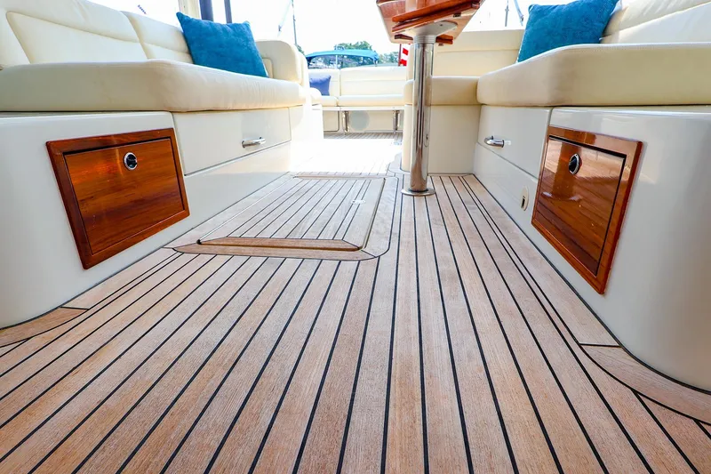 Slide: The Image of Luxurious 2010 MJM 40z Downeast yacht interior with teak flooring and cushioned seating. - 33