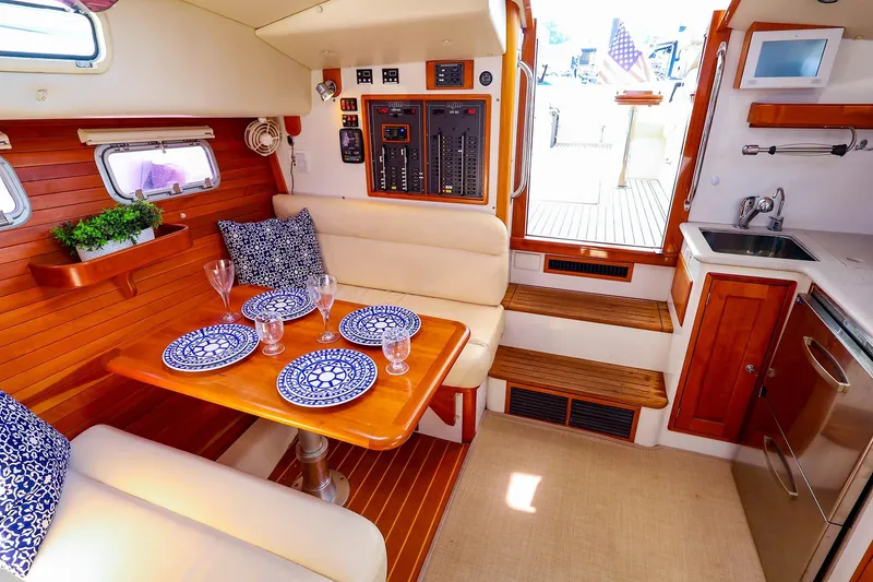 Slide: The Image of Luxurious interior of 2010 MJM 40z Downeast yacht with elegant dining area and kitchenette. - 36