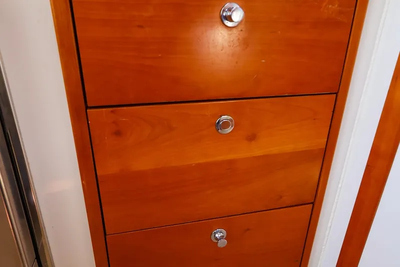 Slide: The Image of Wooden drawers with chrome knobs on a 2010 MJM 40z Downeast boat. - 44