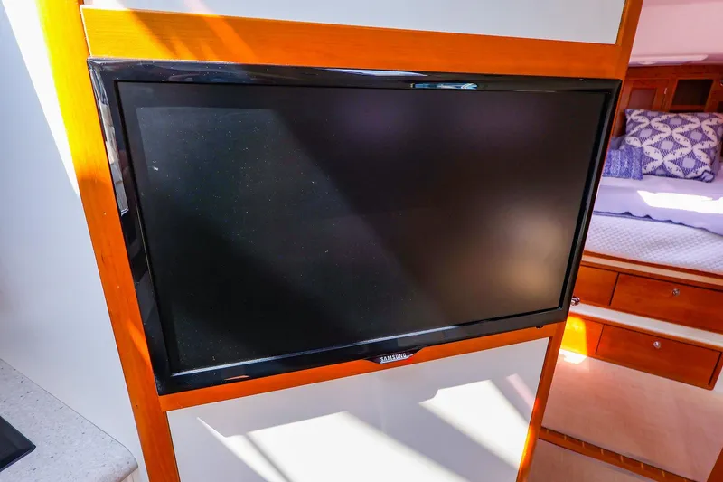 Slide: The Image of Flat-screen TV in 2010 MJM 40z Downeast yacht interior, near cozy sleeping area. - 45