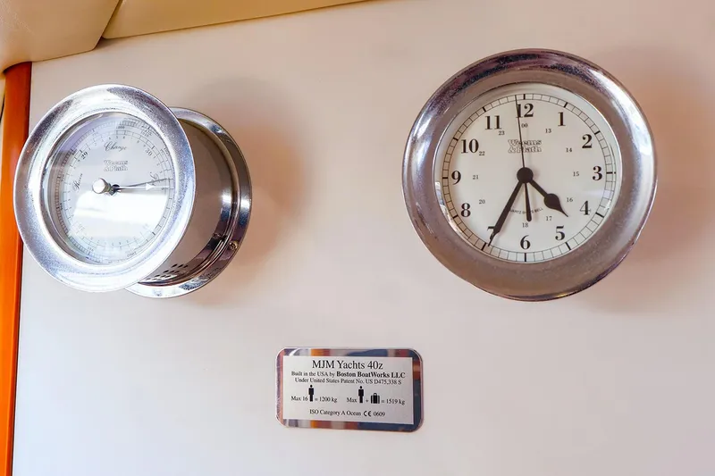 Slide: The Image of Nautical instruments on 2010 MJM 40z Downeast yacht, featuring clock and barometer. - 46