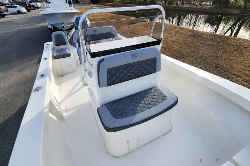 Slide: The Image of 2025 May-Craft 192 CC boat interior with gray seating and steering console. - 11