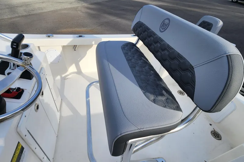 Slide: The Image of 2025 May-Craft 192 CC boat interior with steering wheel and cushioned seating. - 12