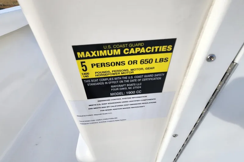 Slide: The Image of 2025 May-Craft 192 CC boat capacity label, 5 persons or 650 lbs, U.S. Coast Guard certified. - 15