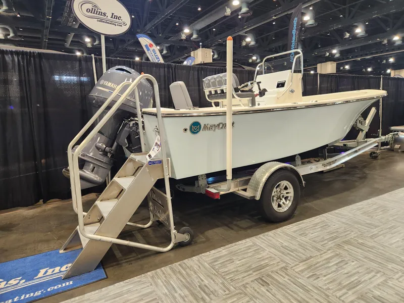 Slide: The Image of 2025 May-Craft 192 CC boat on trailer with Yamaha outboard motor, parked outdoors. - 2