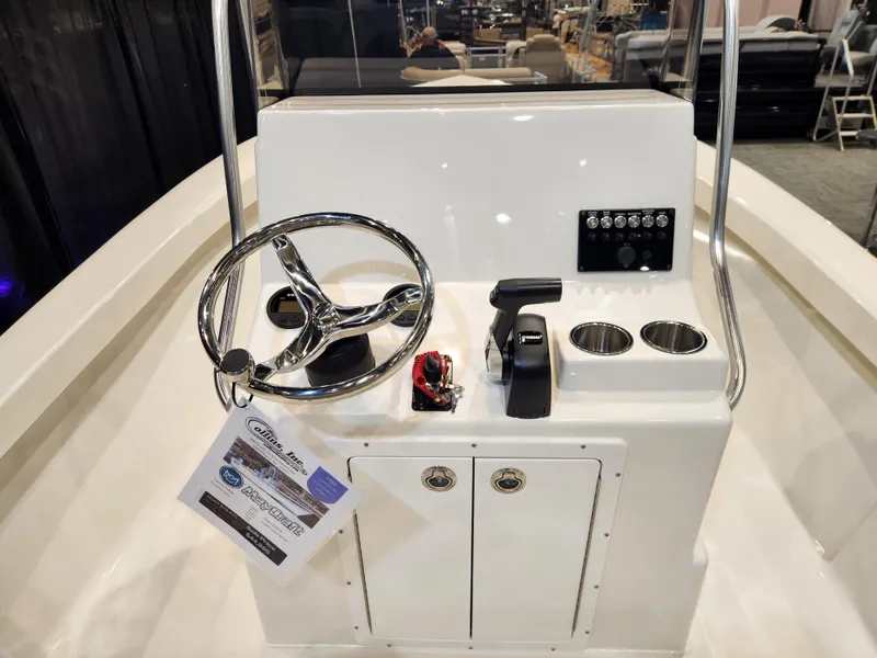 Slide: The Image of 2025 May-Craft 192 CC boat on trailer, parked outdoors under clear sky. - 6