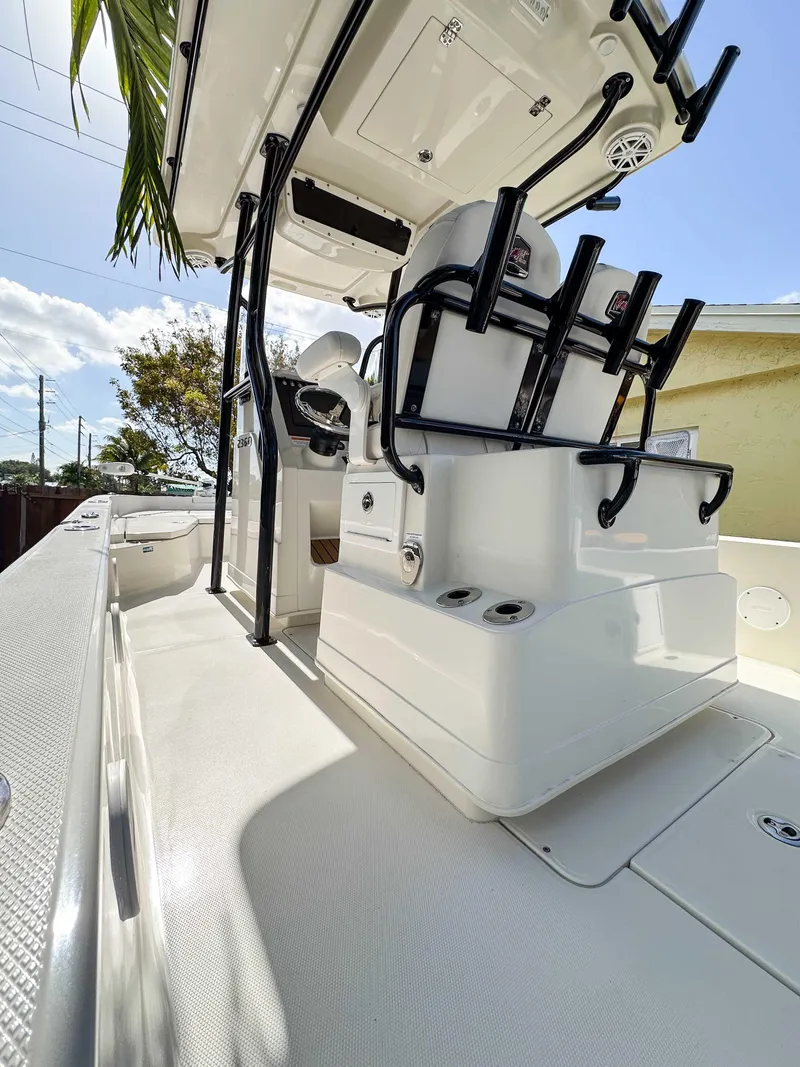 Slide: The Image of 2023 Ranger 2360 Bay boat interior with seating and storage features. - 11