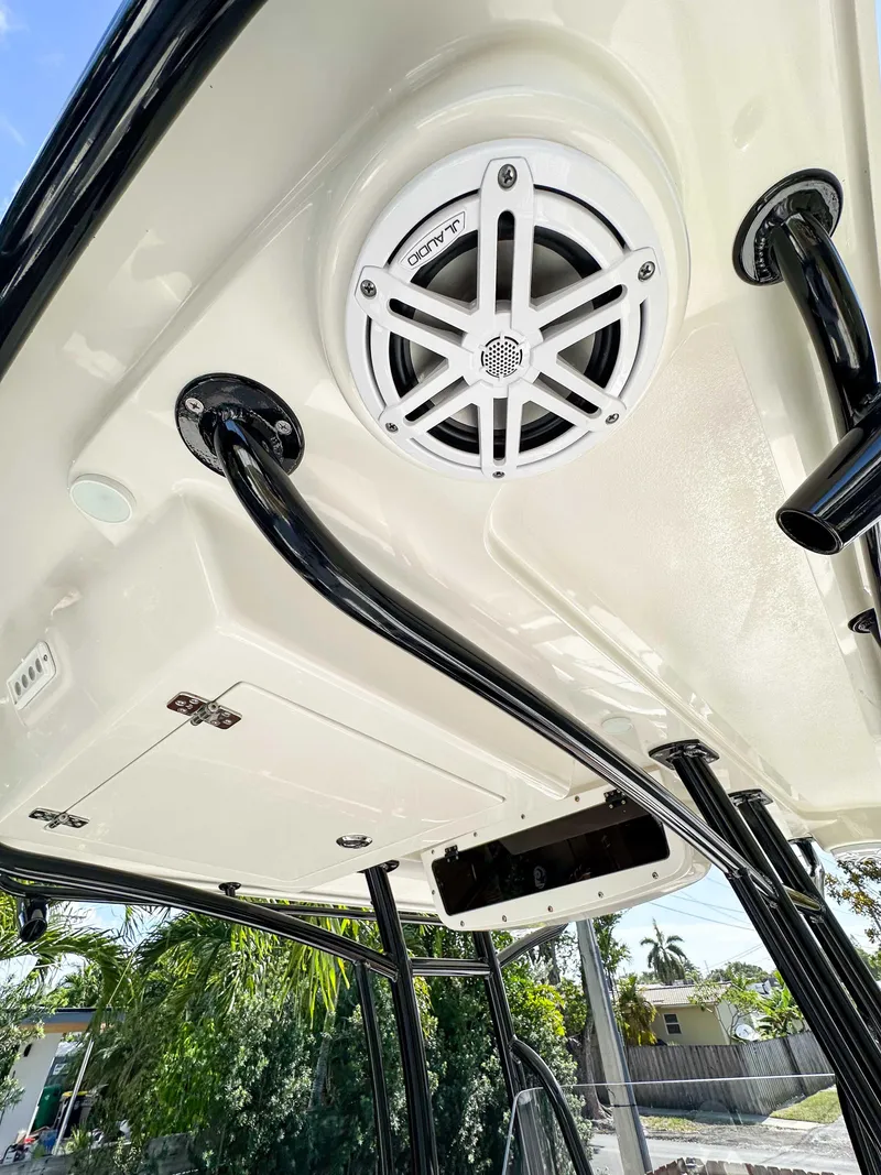 Slide: The Image of 2023 Ranger 2360 Bay boat with mounted speaker and sturdy black supports. - 13