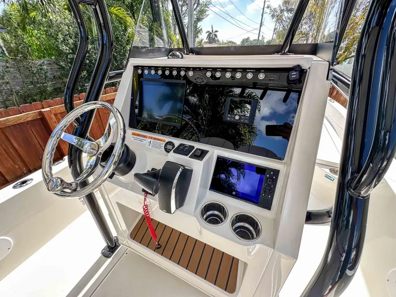 Slide: The Image of 2023 Ranger 2360 Bay boat console with steering wheel and electronic displays. - 8