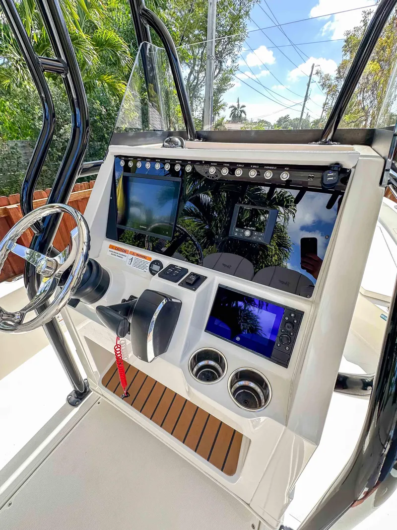 Slide: The Image of 2023 Ranger 2360 Bay boat console with advanced navigation and control systems. - 9