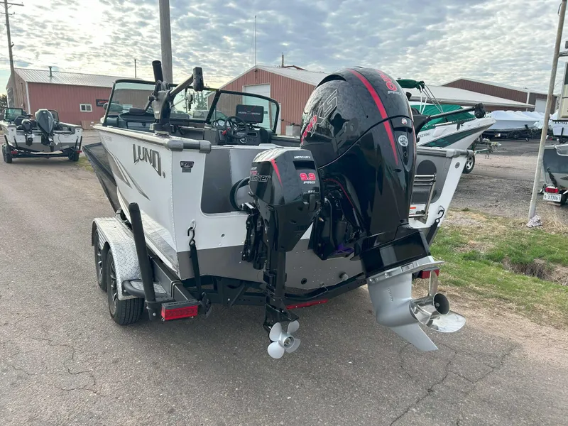 Slide: The Image of 2024 Lund 1875 Fisherman boat with outboard motor on a trailer. - 6