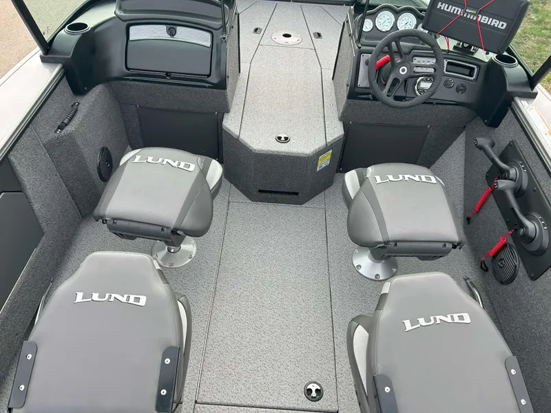 Slide: The Image of 2024 Lund 1875 Fisherman boat interior with seating and steering console. - 8