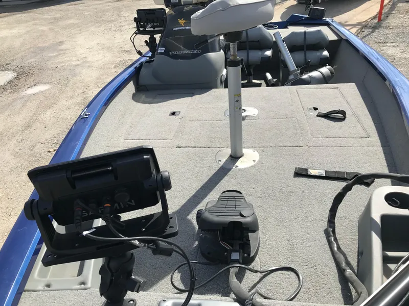 Slide: The Image of 2012 Tracker Pro Team 175 TF boat interior with fishing equipment and seating. - 14