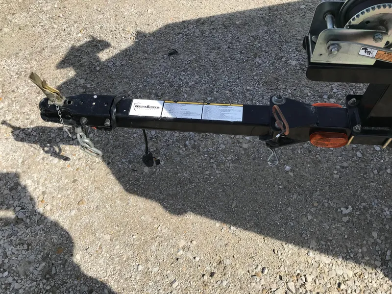 Slide: The Image of Trailer hitch of 2012 Tracker Pro Team 175 TF on gravel surface. - 17