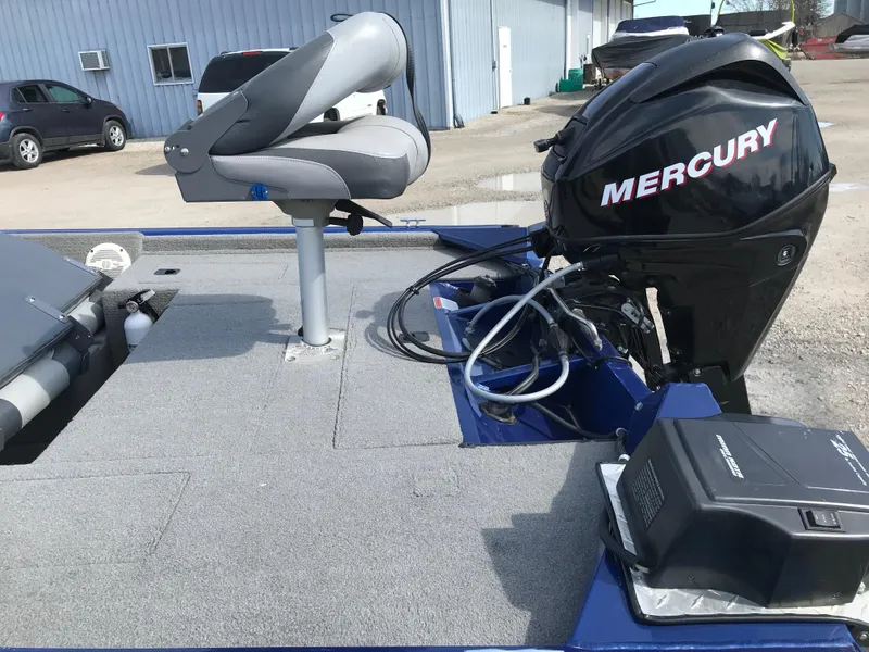 Slide: The Image of 2012 Tracker Pro Team 175 TF boat with Mercury outboard motor and swivel seat. - 4