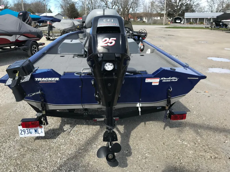 Slide: The Image of 2012 Tracker Pro Team 175 TF boat with 25 EFI motor, parked outdoors. - 5
