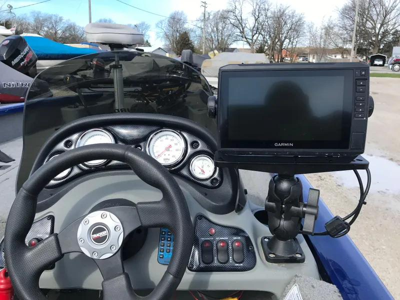 Slide: The Image of 2012 Tracker Pro Team 175 TF boat dashboard with Garmin GPS and steering wheel. - 7