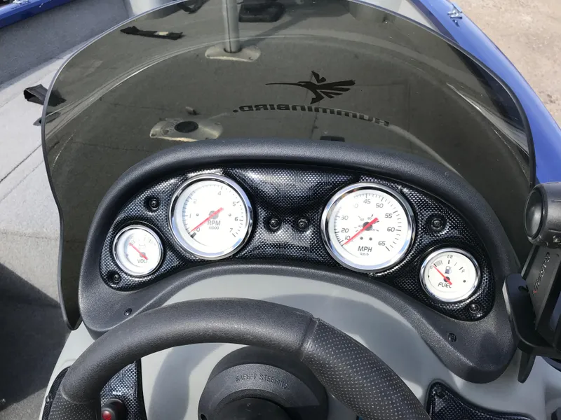 Slide: The Image of 2012 Tracker Pro Team 175 TF boat dashboard with gauges and steering wheel. - 8