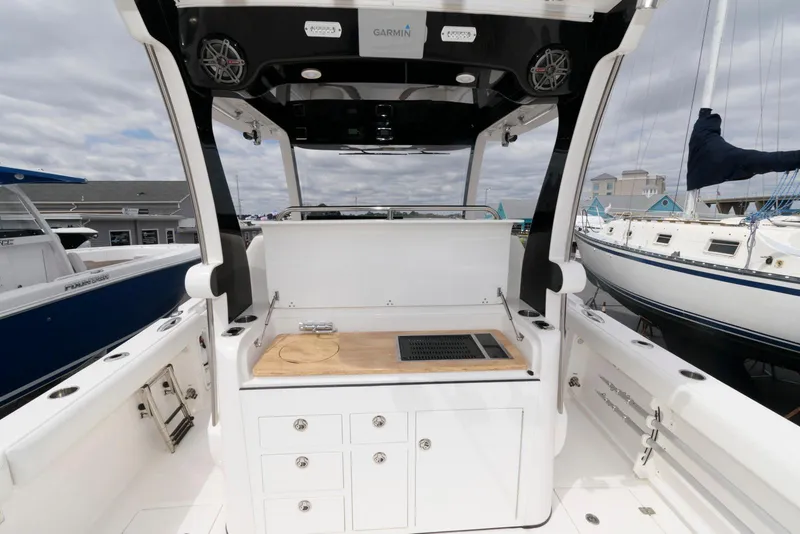 Slide: The Image of Edgewater 368CC 2017 boat interior with sleek design and modern amenities. - 13