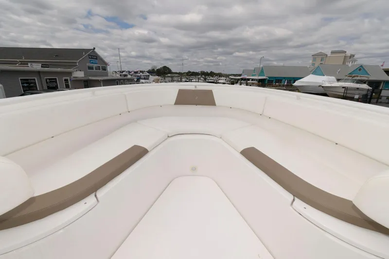 Slide: The Image of Bow seating area of 2017 Edgewater 368CC boat under cloudy sky. - 23