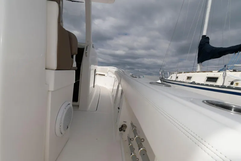 Slide: The Image of 2017 Edgewater 368CC boat deck with seating and cloudy sky background. - 27