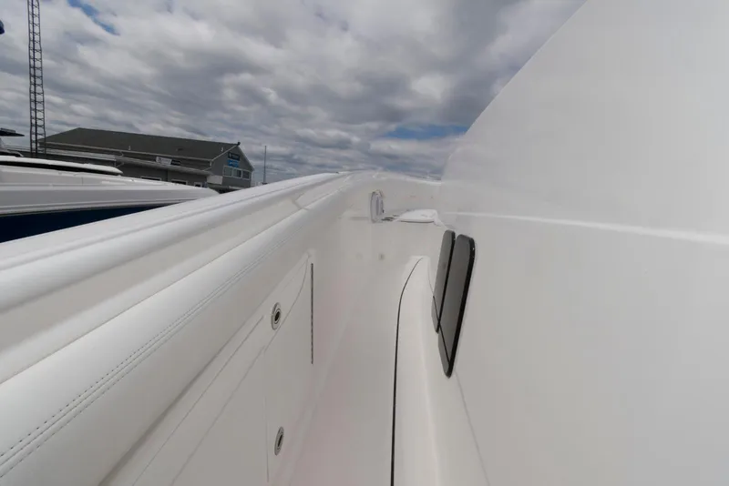 Slide: The Image of 2017 Edgewater 368CC boat deck with cloudy sky background. - 28