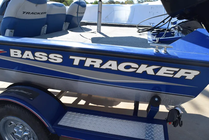 Slide: The Image of 2006 Tracker Pro Team 175 TX boat with "Bass Tracker" branding, blue color. - 5