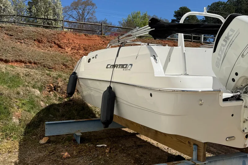 Slide: The Image of 2022 Sea Pro 2400 SC DECK boat on trailer, side view, outdoors. - 6