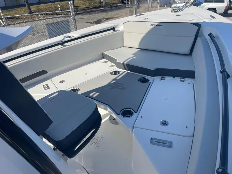 Slide: The Image of 2025 Sea Pro 225 Sandbar boat interior with seating and cup holders. - 10
