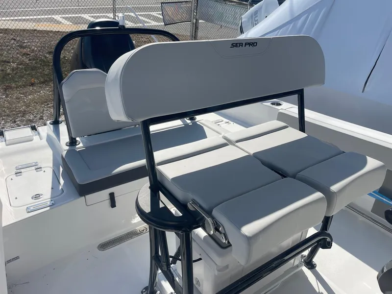 Slide: The Image of 2025 Sea Pro 225 Sandbar boat interior with seating and console. - 19