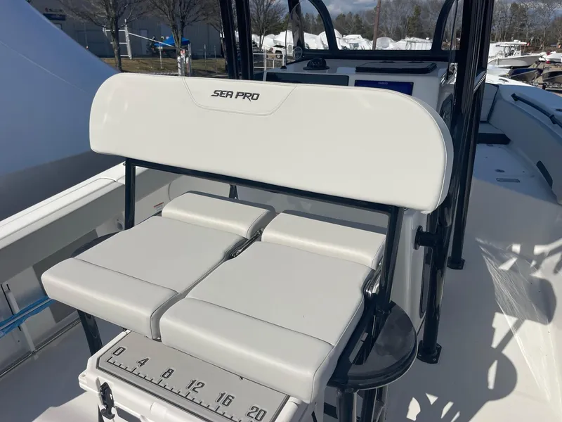 Slide: The Image of 2025 Sea Pro 225 Sandbar boat interior with cushioned seating and measuring scale. - 21