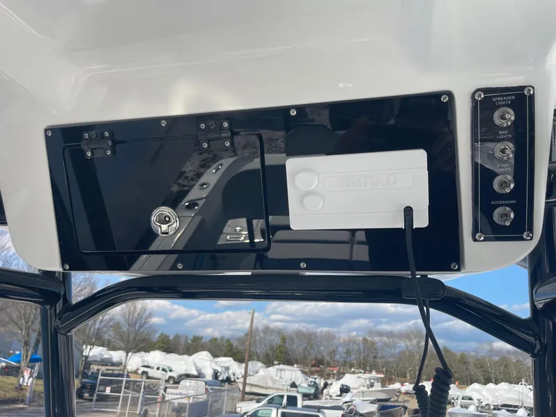 Slide: The Image of 2025 Sea Pro 225 Sandbar boat console with controls and storage compartment. - 8