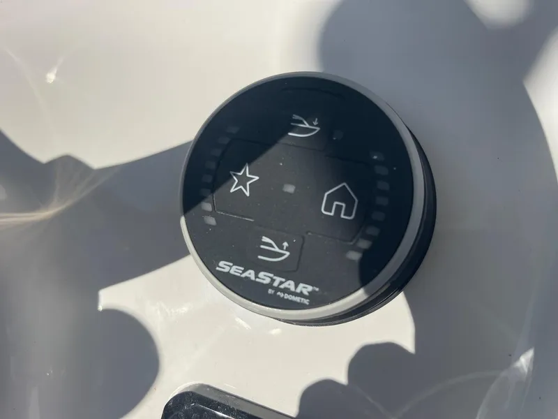 Slide: The Image of Control panel of 2025 Sea Pro 225 Sandbar boat with SeaStar branding. - 9
