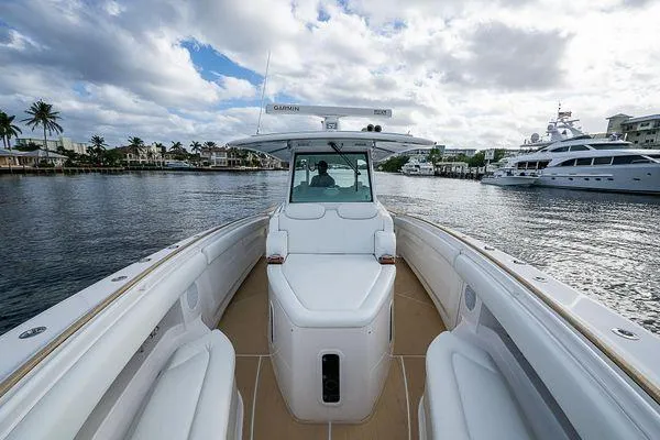 Slide: The Image of 2020 HCB 42 Lujo boat on water, featuring sleek design and luxurious seating. - 10