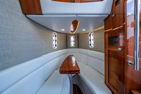 Slide: The Image of Luxurious interior of 2020 HCB 42 Lujo boat with elegant seating and wood accents. - 17