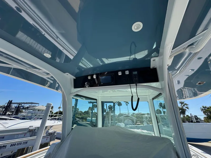 Slide: The Image of 2020 HCB 42 Lujo boat interior with control panel and overhead view. - 5