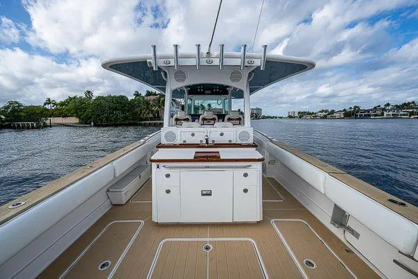 Slide: The Image of 2020 HCB 42 Lujo boat with spacious deck and modern amenities on a scenic waterway. - 9