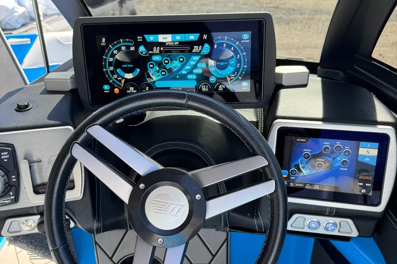Slide: The Image of Dashboard of 2019 Malibu Wakesetter 23 LSV with digital displays and steering wheel. - 10
