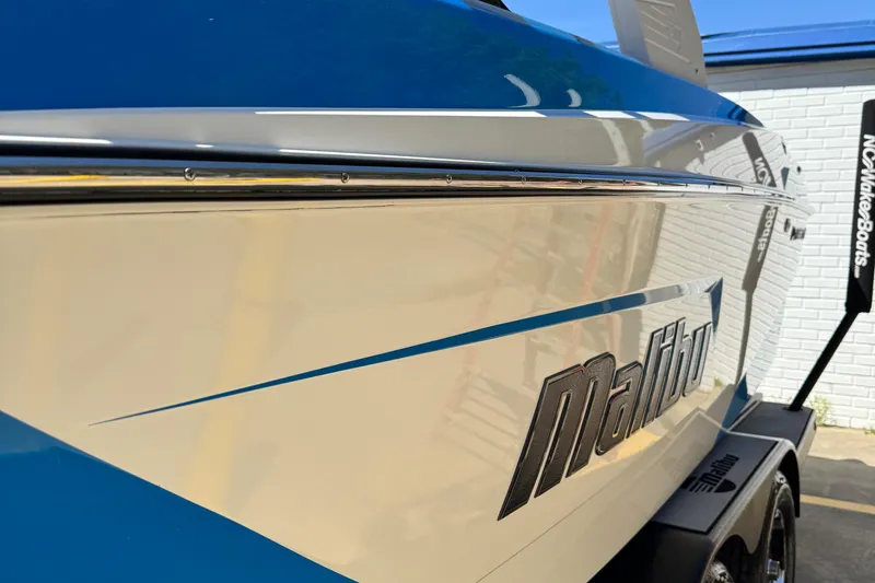 Slide: The Image of 2019 Malibu Wakesetter 23 LSV boat, blue and white exterior, close-up view. - 14