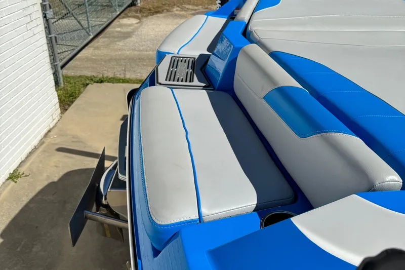 Slide: The Image of 2019 Malibu Wakesetter 23 LSV boat with blue and white seating detail. - 16